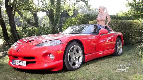 Airbags On The Hood: Busty Blonde's Big Tits Exposed!