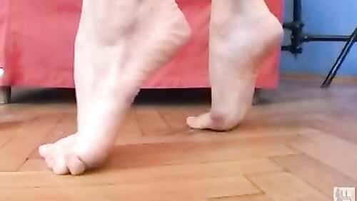 Gymnast nibbles on her toes!