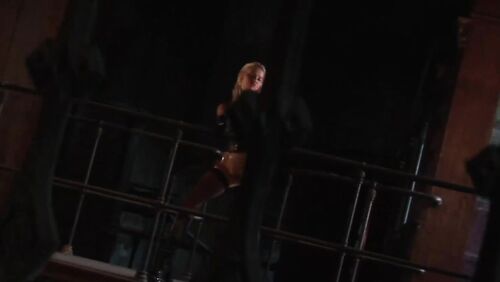 Leather Corset, Mesh Stockings And a 9mm